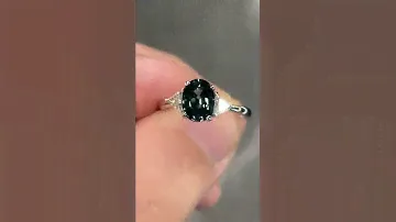No heat flawless teal blue sapphire ring indoors